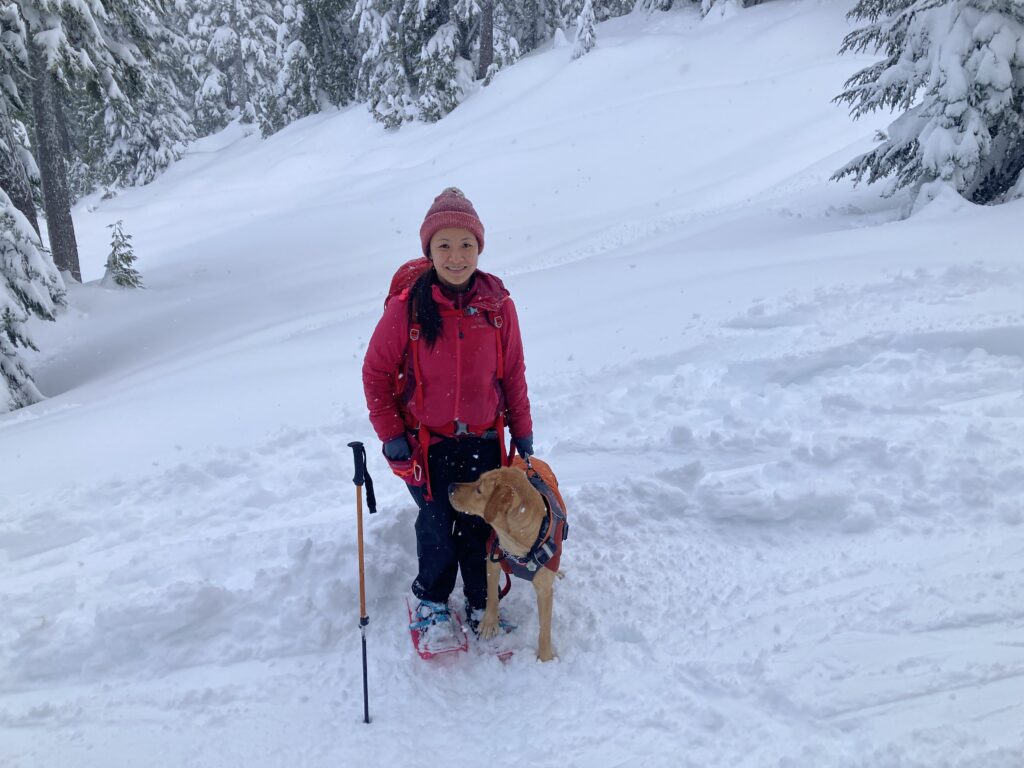 Dr. Ruanne Lai and her dog Portia snowshoeing