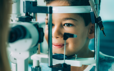 Boy getting his eyes examined.