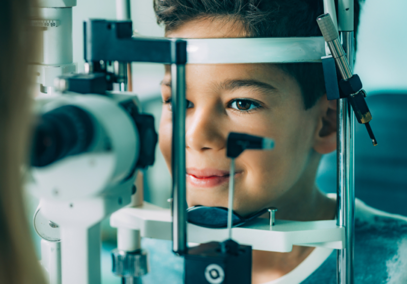 Boy getting his eyes examined.