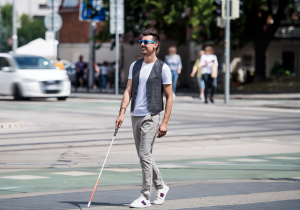 Man walking with a white cane